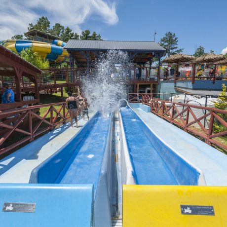 Pirates Bay Waterpark in Leesburg AL (Northern Alabama), a sprawling aquatic playground located on a hilltop overlooking Weiss Lake. There’s fun for everyone with tube slides, body slides, multiple pools, waterfalls, splash playground, food, drinks, parties, and so much more!
